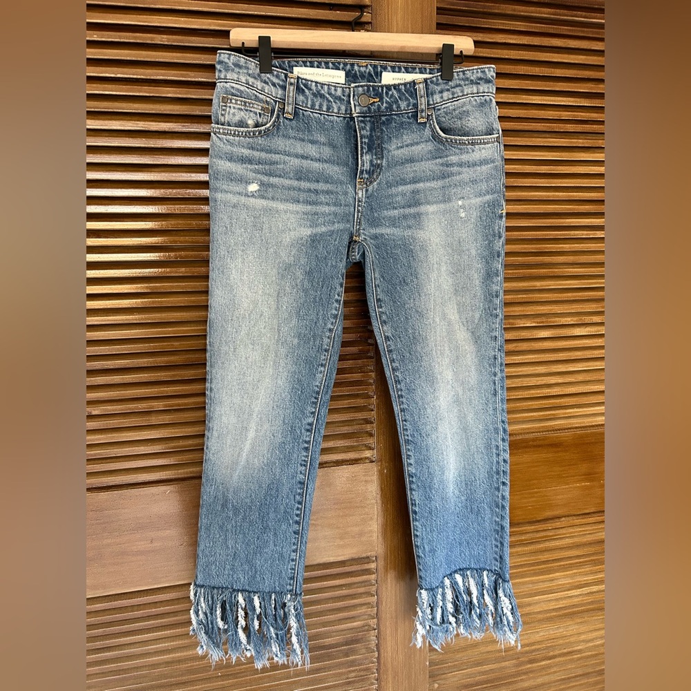 Pilcro and the Letterpress Hyphen fringe crop jeans in a blue wash